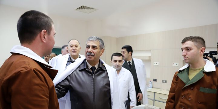 Azerbaijan`s defense minister meets with servicemen undergoing treatment at hospital on holiday