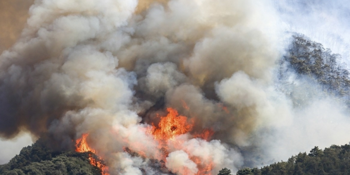 Wildfire in Greece triggers explosions at an ammunition depot and the relocation of fighter jets