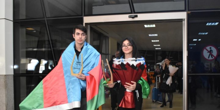 Azerbaijan`s world chess champions return home
