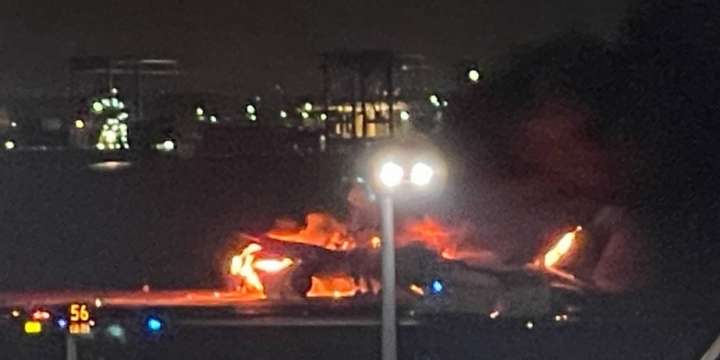Japan Airlines plane in flames on runway at Tokyo’s Haneda airport